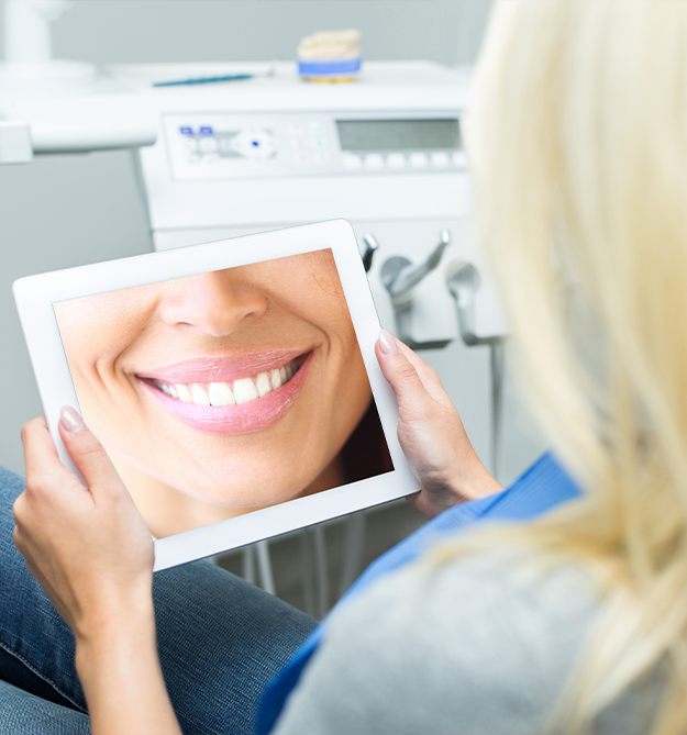 Woman looking at smile tablet computer