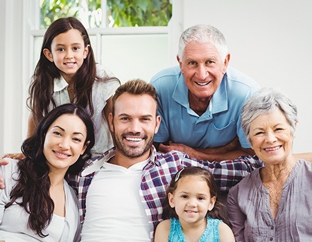 Three generations of family smiling together