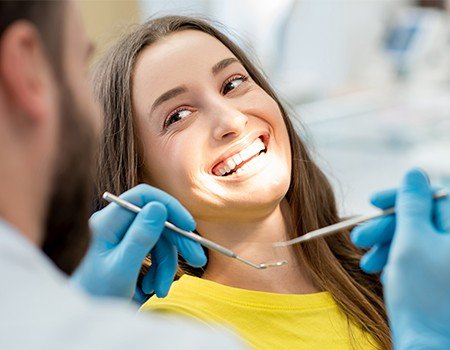 Smiling woman in dental chair