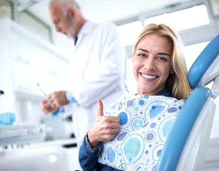 Smiling woman in the dental chair