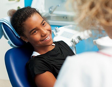 Smiling woman in dental chair