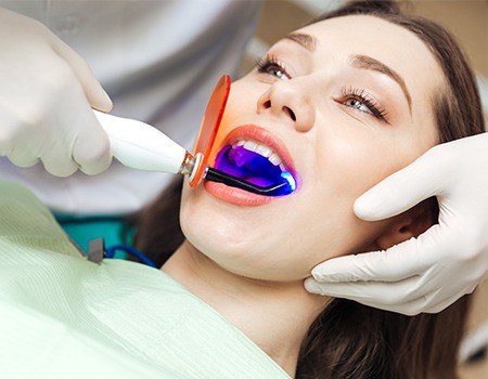 Woman receiving dental bonding treatment