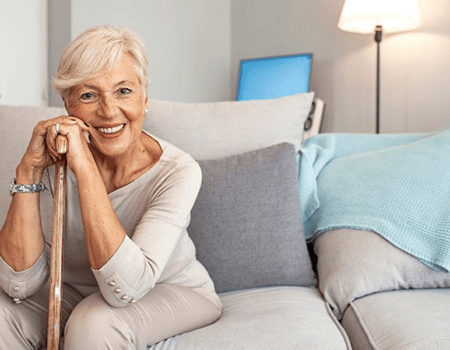 a woman in Willow Grove smiling with her new dentures 