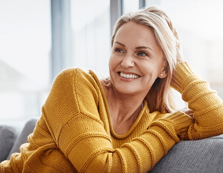 a woman smiling after getting dentures in Willow Grove