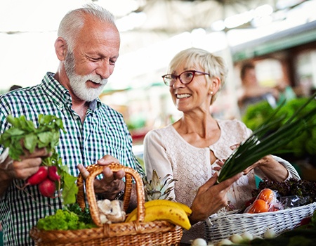 older couple shopping for healthy food