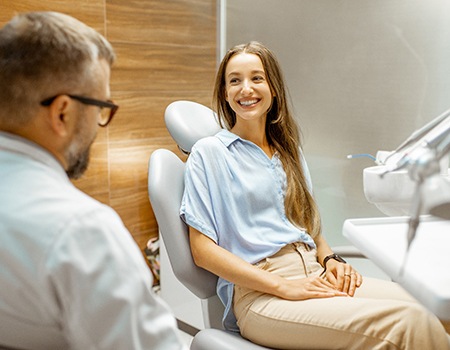 Lady speaks to her dentist