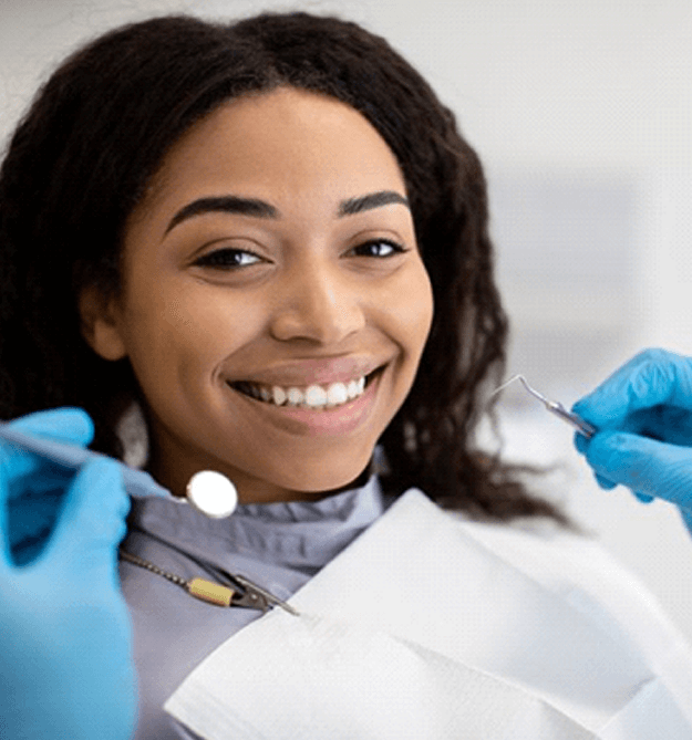 a patient smiling during a dental checkup