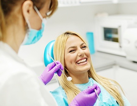 Laughing woman in dental chair