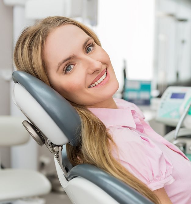 Smiling woman in dental chair