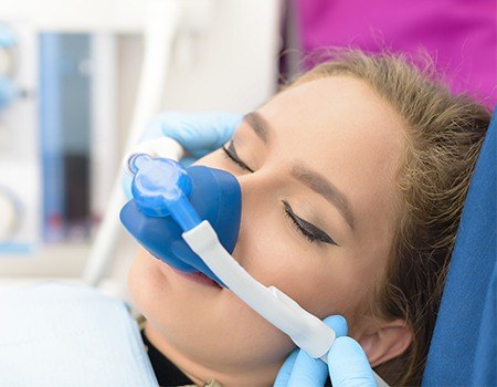 Woman with nitrous oxide nasal mask