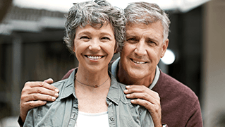 Smiling older man and woman