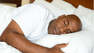 Man in bed sleeping soundly