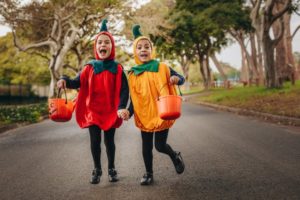 two children trick-or-treating