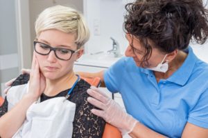 Woman at dentist for a dental emergency.