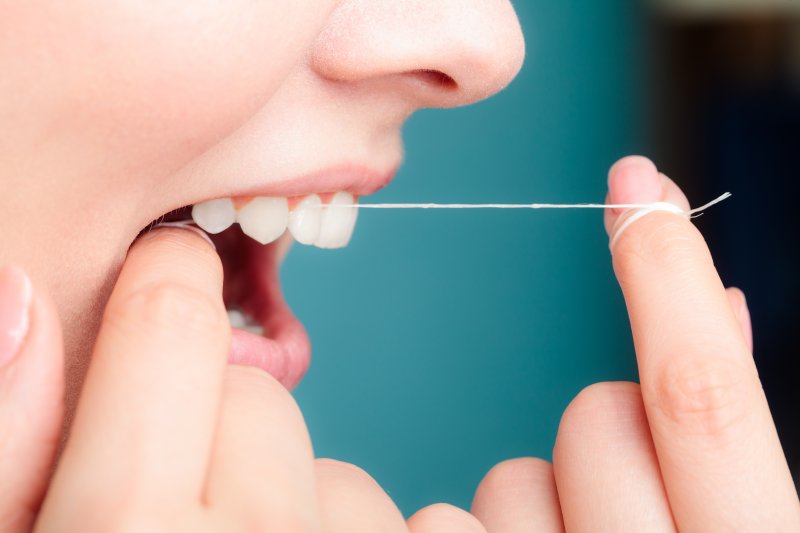 Woman flossing