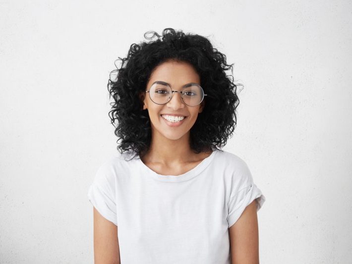 patient smiling after getting dental implant surgery