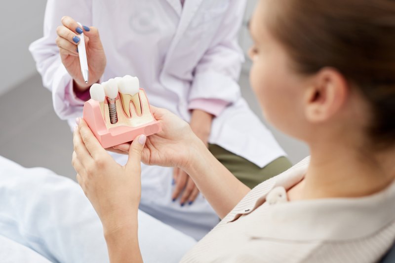 A dentist explaining dental implant success in Willow Grove