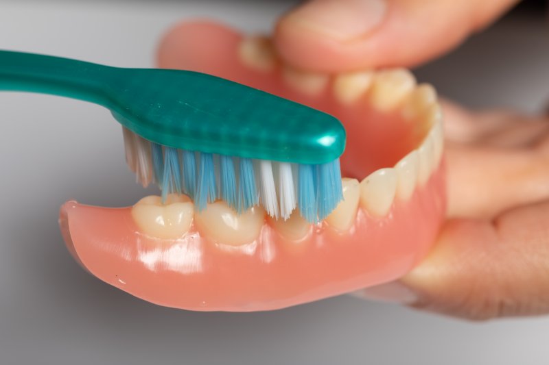 Dentures being brushed